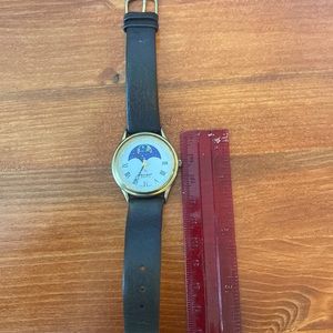 Peugeot watch with dark brown leather band